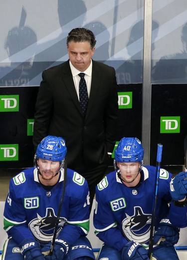 Head Coach Travis Green of the Vancouver Canucks looks on in Game One against the Minnesota Wild in the Western Conference Qualification Round prior to the 2020 NHL Stanley Cup Playoffs at Rogers Place on August 02, 2020 in Edmonton, Alberta, Canada.