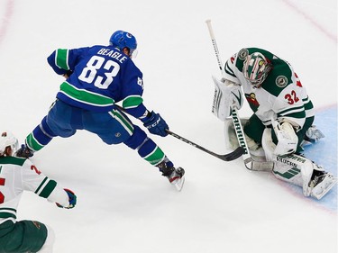 Alex Stalock #32 of the Minnesota Wild makes a save against Jay Beagle #83 of the Vancouver Canucks in Game 2.