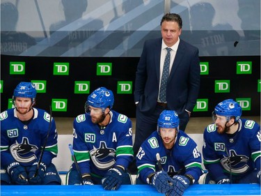 Head Coach Travis Green of the Vancouver Canucks looks on from the bench in Game 2.