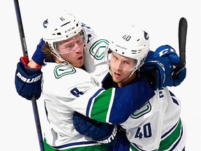 Brock Boeser and Elias Pettersson, right, combined for the winning goal Tuesday night at Rogers Place in Edmonton.