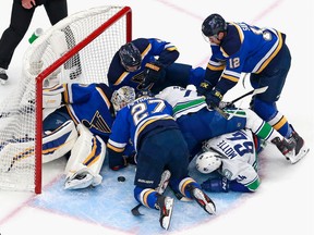 St. Louis and Vancouver Canucks have had a number of close battles in their first-round playoff series, but this one in the Blues' crease on Friday attracted a larger than usual crowd at Rogers Place in Edmonton.