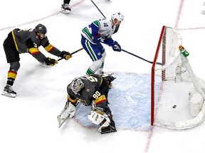Elias Pettersson of the Vancouver Canucks scores a slick goal on Robin Lehner of the Vegas Golden Knights during Tuesday's NHL playoff action at Rogers Place in Edmonton. The Canucks and Knights are tied 1-1 in the best-of-seven series. Game 3 goes Thursday night.