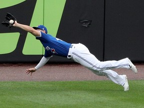 Randal Grichuk of the Toronto Blue Jays makes a diving catch of a hit by Anthony Santander of the Baltimore Orioles during the first inning at Sahlen Field on August 28, 2020 in Buffalo, New York.