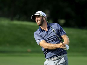 Dustin Johnson plays a second shot on the 18th hole during the third round of the BMW Championship at Olympia Fields Country Club on Aug. 29, 2020 in Olympia Fields, Illinois.