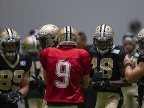 Wearing the name of Jacob Blake on their helmets, the offence breaks huddle with New Orleans Saints quarterback Drew Brees during training camp on Thursday.