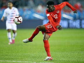 Alphonso Davies #12 of Canada shots on goal during a CONCACAF Nations League game against the United States at BMO Field on October 15, 2019 in Toronto.