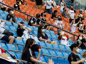 Several MLB teams are exploring various ways to bring fans back into the game experience while taking health precautions. Teams in the Korean Baseball Organization are allowing stadiums, like the one in Seoul, above, to host fans at about 10 per cent capacity while wearing face masks to avoid the spread of COVID-19.