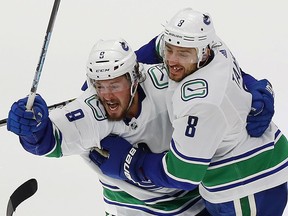 J.T. Miller, left, knows replacing departed players, including Chris Tanev, won't be easy for the Canucks.