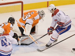 Flyers goalie Carter Hart stymies Canadiens' Nick Suzuki during second period last night at the Scotiabank Centre in Toronto.