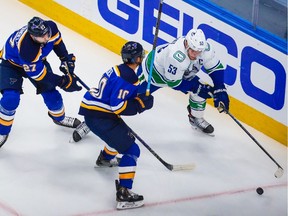 Vancouver captain Bo Horvat, right, scored twice and played a strong game as the Canucks beat the St. Louis Blues 5-2 on Wednesday in Game 1 of their opening-round playoff series in Edmonton.