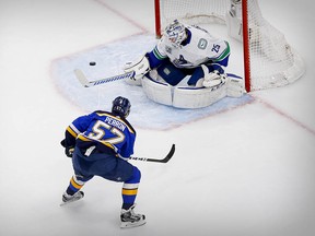 Canucks goalie Jacob Markstrom stops a shot by St. Louis Blues left wing David Perron in the second period of Game 5. He faced 18 shots in that period as the Canucks fought back into the lead.