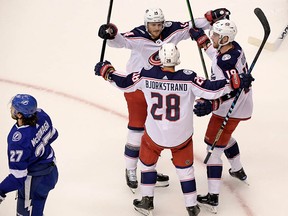 Columbus Blue Jackets right wing Oliver Bjorkstrand celebrates his goal against the Tampa Bay Lightning with teammates during the first period in Game 2 of the first round of the 2020 Stanley Cup Playoffs at Scotiabank Arena in Toronto. Mandatory Credit: