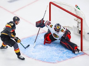 Corey Crawford reacts as Vegas Golden Knights right wing Reilly Smith scores in overtime to win Game 2 in the first round of the 2020 Stanley Cup playoffs at Rogers Place.