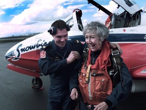 Kay Alsop gets fitted for a parachute before getting into the Snowbird's T-33 at Vancouver airport on April 12, 1996.