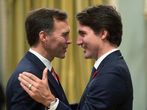 Prime Minister Justin Trudeau, right, goes face-to-face with Finance Minister Bill Morneau at Rideau Hall in Ottawa on Wednesday, November 4, 2015.