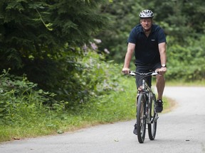 Anmore Mayor John McEwen chairs Metro Vancouver's parks committee. Here he's riding on the Brunette-Fraser Greenway.