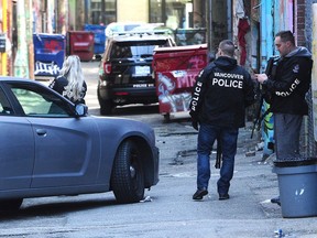 VANCOUVER, BC., April 24, 2019 -- Armed police respond to an incident behind 58 E Hastings St in Vancouver, BC., April 24, 2019. (NICK PROCAYLO/PostMedia) 00057178A ORG XMIT: 00057178A [PNG Merlin Archive]