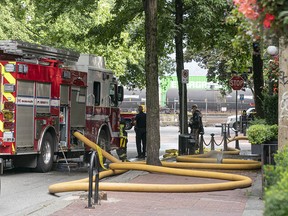 Members of the Vancouver Fire Department assist with a police incident on Abbott Street and Water in Vancouver on Tuesday.