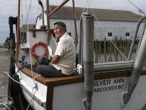 Kelvin Higo, son of a Japanese fisherman, sits on the Silver Ann, a family heirloom and the last boat built at the Britannia Ship Yards in Richmond