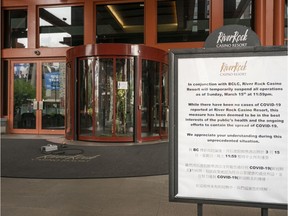 A sign explaining the closure of the River Rock Casino stands by the door in Richmond.