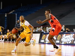 Edmonton Stingers guard Xavier Moon drives on Fraser Valley Bandits guard Kyle Johnson during a game earlier in the tournament at the CEBL's Summer Series. Moon had 31 points to lead the Stingers past the Bandits in the CEBL championship game on Sunday morning.