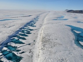 A rift in the Milne Ice Shelf on Ellesmere Island is shown in a 2019 handout photo. The Canadian Ice Service says a huge chunk has broken off Canada's last fully intact ice shelf on the northwest coast of Nunavut's Ellesmere Island. The Milne Ice Shelf is 40 per cent smaller after the split that began late last month. THE CANADIAN PRESS/HO-Carleton University-Derek Mueller MANDATORY CREDIT
