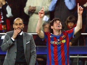 Barcelona's Lionel Messi (right) celebrates in front of his coach Pep Guardiola after scoring a goal against VfB Stuttgart during their Champions League last 16, second leg soccer match at the Nou Camp stadium in Barcelona March 17, 2010.