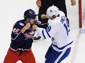 Leafs centre Jason Spezza (right) scraps with Blue Jackets’ Dean Kukan during Toronto’s stunning Game 4 win. GETTY IMAGES