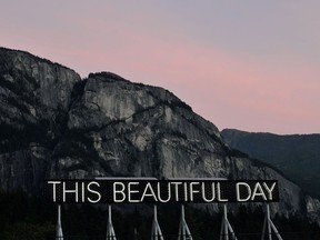 This Beautiful Day text artword, with Stawamus Chief in the background, when it was installed in Squamish.