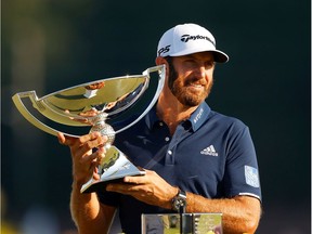 Dustin Johnson of the United States celebrates with the FedEx Cup Trophy after winning in the final round of the TOUR Championship at East Lake Golf Club on Sept. 07, 2020 in Atlanta, Georgia.