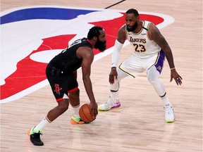 LeBron James of the Los Angeles Lakers defends James Harden of the Houston Rockets during the fourth quarter in Game Three of the Western Conference Second Round during the 2020 NBA Playoffs at AdventHealth Arena at the ESPN Wide World Of Sports Complex on September 08, 2020 in Lake Buena Vista, Florida.