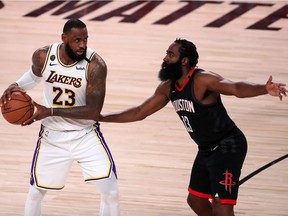 LeBron James #23 of the Los Angeles Lakers drives the ball against James Harden #13 of the Houston Rockets during the third quarter in Game Five of the Western Conference Second Round during the 2020 NBA Playoffs at AdventHealth Arena at the ESPN Wide World Of Sports Complex on September 12, 2020 in Lake Buena Vista, Florida. NOTE TO USER: User expressly acknowledges and agrees that, by downloading and or using this photograph, User is consenting to the terms and conditions of the Getty Images License Agreement.