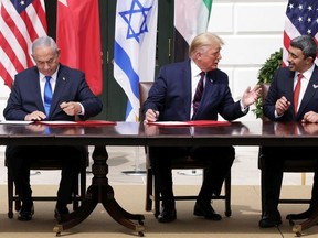 Prime Minister of Israel Benjamin Netanyahu, U.S. President Donald Trump, and Foreign Affairs Minister of the United Arab Emirates Abdullah bin Zayed bin Sultan Al Nahyan participate in the signing ceremony of the Abraham Accords on the South Lawn of the White House on September 15, 2020.