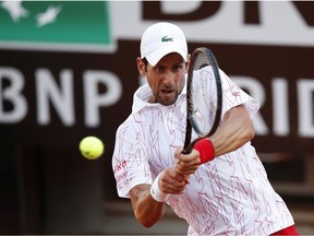 Novak Djokovic of Serbia plays a backhand in his semi-final match against Casper Ruud of Norway during day seven of the Internazionali BNL d'Italia at Foro Italico on September 20, 2020 in Rome, Italy.