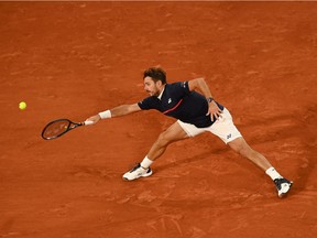 Stan Wawrinka of Switzerland plays a forehand during his Men's Singles first round match against Andy Murray of Great Britain during day one of the 2020 French Open at Roland Garros on September 27, 2020 in Paris, France.