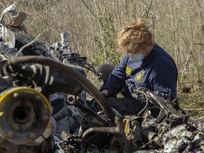 In this handout photo provided by the National Transportation Safety Board, an investigator works at the scene of the helicopter crash that killed former NBA star Kobe Bryant and his 13-year-old daughter Gianna on January 27, 2020 in Calabasas, California.