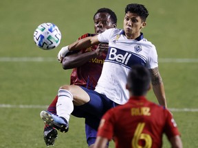 Real Salt Lake defender Nedum Onuoha  and Vancouver Whitecaps forward Fredy Montero, right, battle in the first half of last Sunday's game at Rio Tinto Stadium. Montero set up both goals in the Caps' 2-0 win.