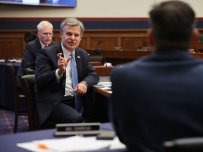 FBI Director Christopher Wray speaks to Congressman Mike Garcia (R) of California during testimony before a House Homeland Security Committee hearing on Sept. 17, 2020 in Washington, D.C.
