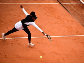 Venus Williams of the U.S. misses the ball played by Slovakia's Anna Karolina Schmiedlova during their women's singles first round tennis match at the Simonne Mathieu court on Day 1 of The Roland Garros 2020 French Open tennis tournament in Paris on September 27, 2020.