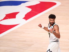 Denver Nuggets guard Jamal Murray (27) celebrates during the second half in game seven of the second round of the 2020 NBA Playoffs against the Los Angeles Clippers at ESPN Wide World of Sports Complex.