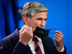 B.C. Liberal Leader Andrew Wilkinson removes his face mask before responding to the B.C. NDP government's $1.5 billion COVID-19 economic recovery plan in Burnaby, B.C. on Thursday, September 17, 2020.