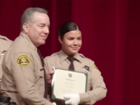 Claudia Apolinar, right, seen at her July 2019 graduation.