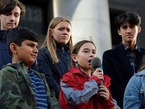 A group of activists, who planned to sue the Canadian government over what they said is inaction on climate change, spoke at a climate strike attended by Greta Thunberg at the Vancouver Art Gallery on Oct. 25, 2019.