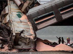 Officials look over the scene where a train carrying potash derailed near Hope on Monday, Sept. 14, 2020.