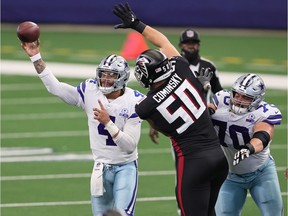 Dallas Cowboys quarterback Dak Prescott (4) throws under pressure from Atlanta Falcons defensive end John Cominsky (50) in the fourth quarter at AT&T Stadium. Mandatory Credit: Matthew Emmons-USA TODAY Sports