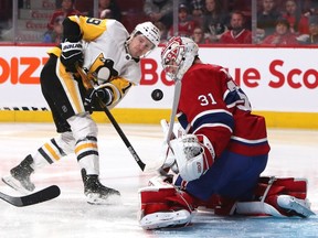 Pittsburgh Penguins centre Jared McCann shoots on Montreal Canadiens goalie Carey Price during a Jan. 4, 2020 NHL game in Montreal.