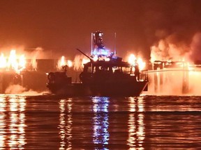 A Vancouver fireboat battles the huge fire destroyed the pier on New Westminster's waterfront.