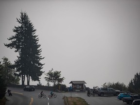 Smoke from wildfires burning in the U.S. obscures the view of downtown Vancouver, at a lookout at Cypress Provincial Park, in West Vancouver, B.C,, on Saturday, September 12, 2020.
