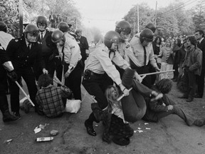 Military police and RCMP move in to evict hippies on Oct. 15, 1970 from buildings being used as a temporary hostel on the Jericho army base. It was dubbed the Battle of Jericho. This photo ran on the front page of the Oct. 16, 1970, edition of The Vancouver Sun. Ken Oakes/Vancouver Sun