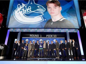 Vasili Podkolzin reacts after being selected tenth overall by the Vancouver Canucks during the first round of the 2019 NHL Draft at Rogers Arena on June 21, 2019 in Vancouver, Canada.